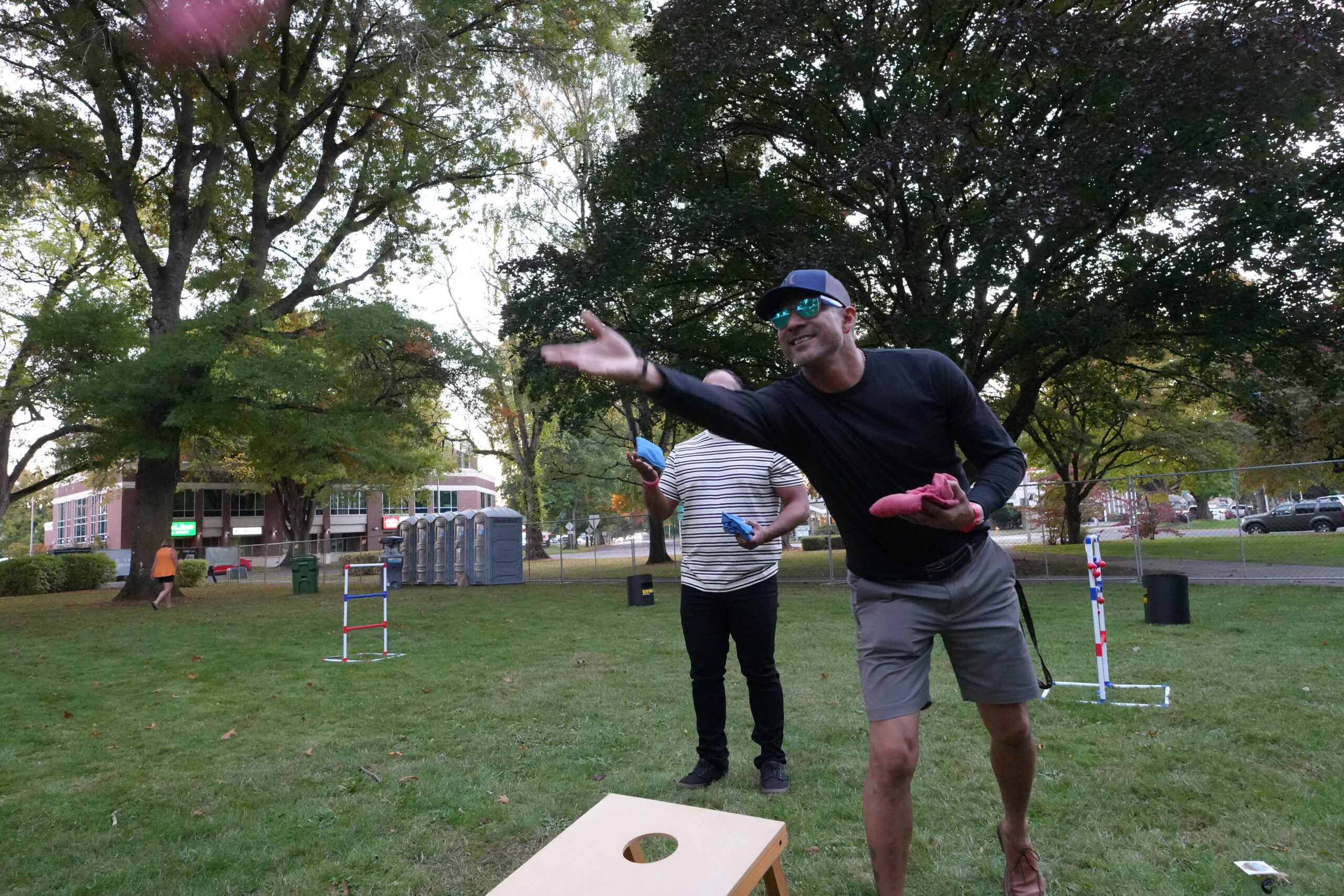 guys playing cornhole at crafted Beerfest in RA Long Park